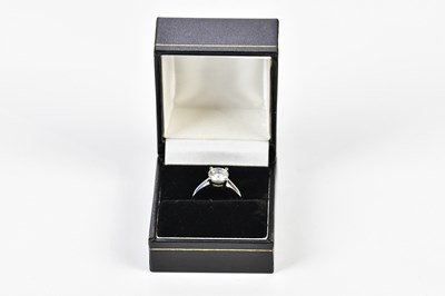 Lot 47 - A platinum and diamond single stone ring, the...