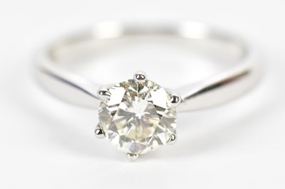 Lot 56 - An 18ct white gold diamond solitaire ring, the...