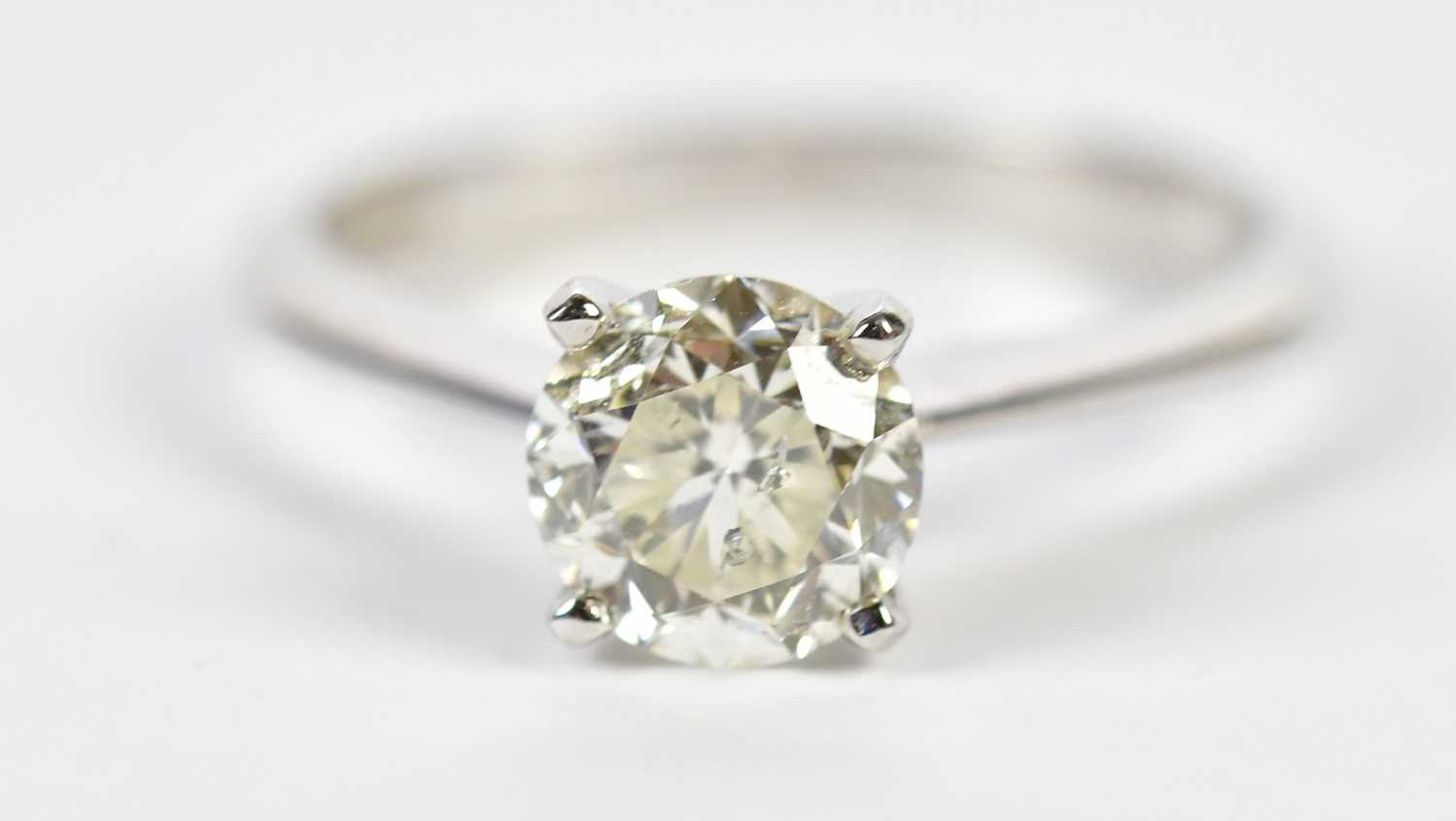 Lot 46 - An 18ct white gold diamond solitaire ring, the...