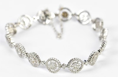 Lot 501 - An 18ct white gold diamond set bracelet formed...