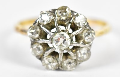 Lot 114 - A yellow metal diamond flower head ring set...