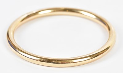 Lot 550 - A 9ct yellow gold bangle, approx. 11.1g,...