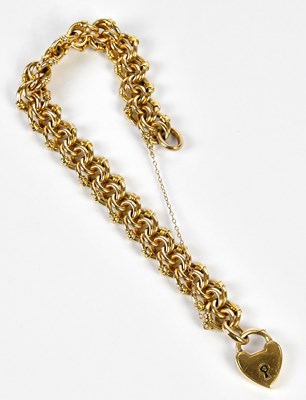 Lot 526 - A 9ct yellow gold bracelet with padlock clasp...