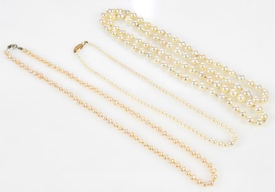 Lot 746 - Three strands of pearls, one with a yellow...