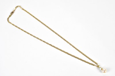 Lot 437 - A 9ct yellow gold flat link chain suspending a...