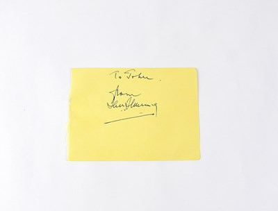 Lot 825 - IAN FLEMING; a torn page from an autograph...