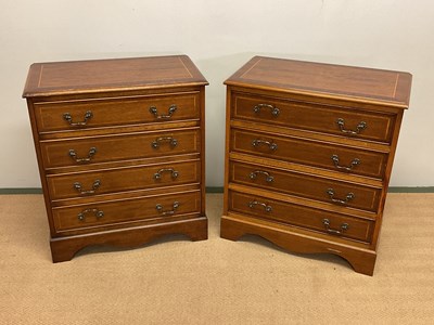 Lot 603 - A pair of reproduction mahogany four drawer...