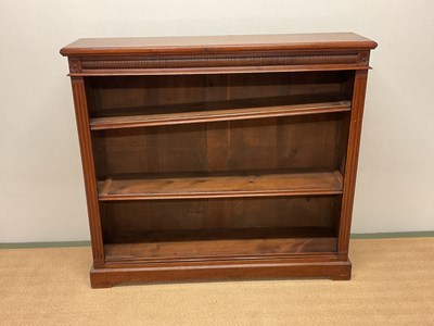 Lot 594 - A Victorian walnut open bookcase with two...