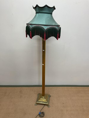 Lot 535 - A brass standard lamp with fluted column,...