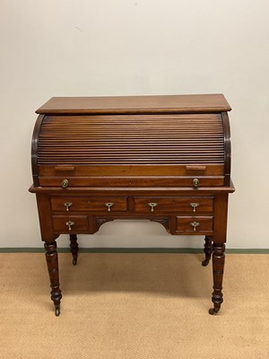 Lot 580 - A late Victorian mahogany roll top desk with...