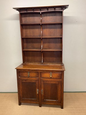 Lot 622 - A reproduction oak dresser with boarded plate...