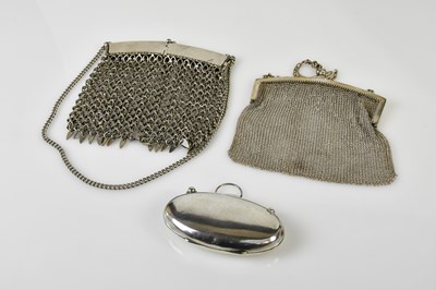 Lot 704 - A George V hallmarked silver silk lined purse...