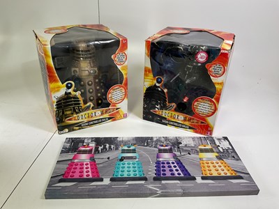Lot 81 - Two boxed 14" remote control toy Daleks in...