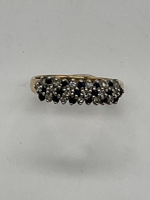 Lot 403 - A 9ct yellow gold sapphire and white sapphire...