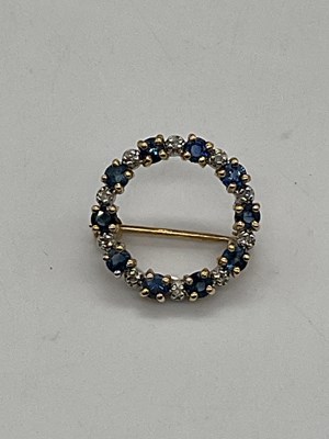 Lot 434 - A 9ct yellow gold sapphire and diamond...