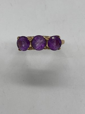 Lot 430 - A 9ct yellow gold and pale amethyst three...