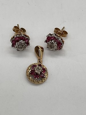 Lot 398 - A yellow metal diamond and ruby circular...