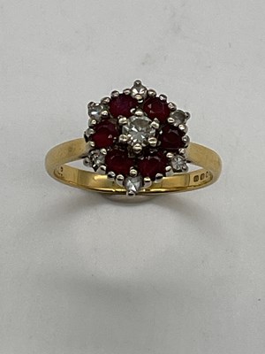 Lot 393 - An 18ct yellow gold ruby and diamond dress...