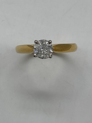 Lot 382 - An 18ct yellow gold diamond solitaire ring,...