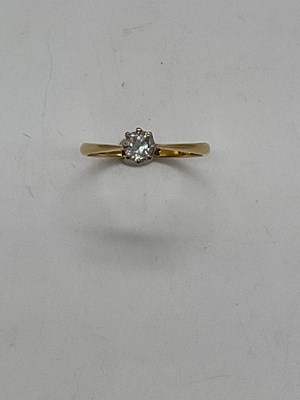 Lot 404 - An 18ct yellow gold diamond solitaire ring,...