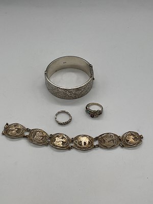 Lot 443 - A silver bangle, a filigree bracelet, and two...