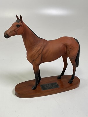 Lot 222 - BESWICK; Red Rum mounted on an oval wooden...