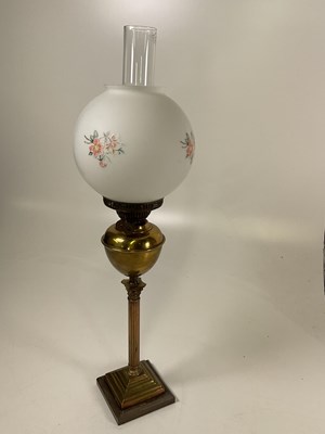 Lot 540 - A brass Corinthian column oil lamp with opaque...