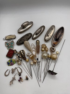 Lot 438 - A small group of hat pins, and a collection of...