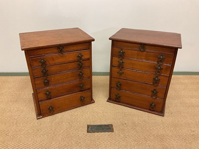 Lot 591 - A pair of mahogany six drawer cabinets, height...