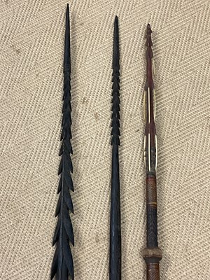 Lot 27 - Three carved Solomon Islands Spears, bought by...