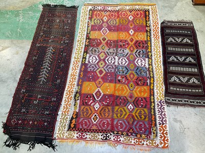 Lot 551 - Three rugs comprising a small kilim runner,...