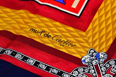 Lot 933 - MUST DE CARTIER; a 100% silk gold, red, cream...