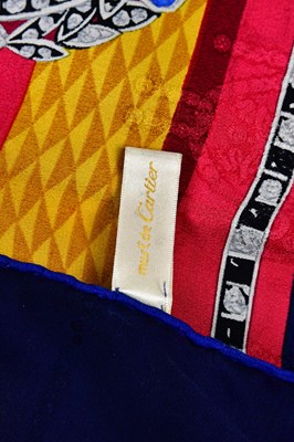 Lot 933 - MUST DE CARTIER; a 100% silk gold, red, cream...