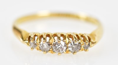 Lot 204 - An 18ct yellow gold five stone graduated ring,...