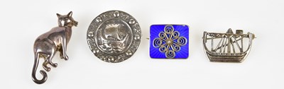 Lot 616 - Four silver brooches, including one modelled...