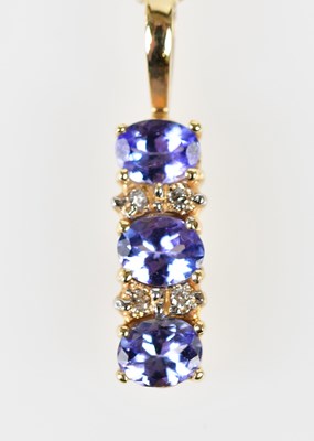 Lot 407 - A 14ct yellow gold and tanzanite pendant...