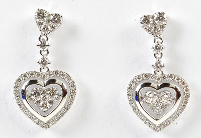 Lot 634 - A pair of 18ct white gold diamond set heart...