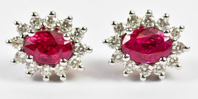 Lot 636 - A pair of 18ct yellow and white gold ruby and...