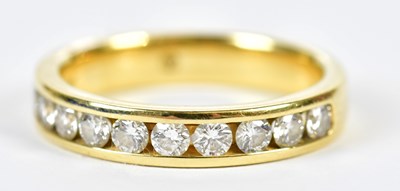 Lot 87 - An 18ct yellow gold diamond set half eternity...