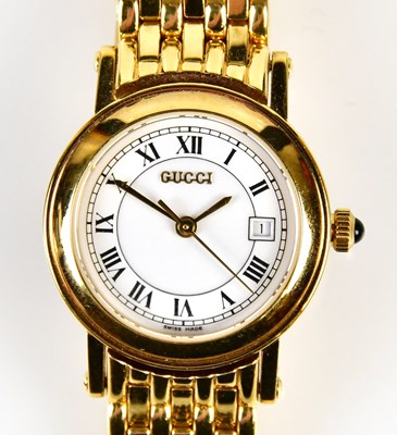 Lot 817 - GUCCI; a gold plated lady's wristwatch with...