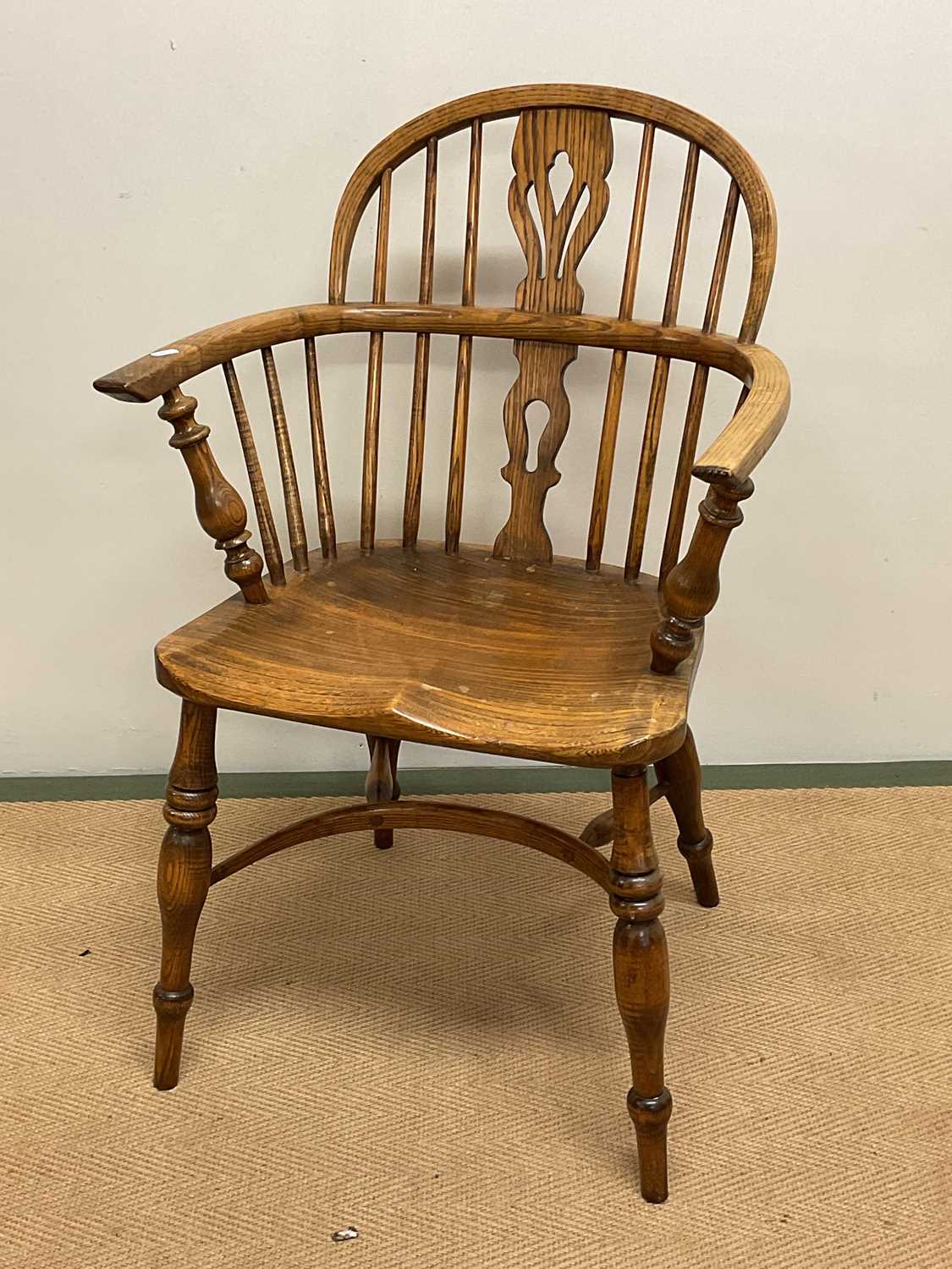 Lot 598 - An oak farm chair with crinoline stretcher,