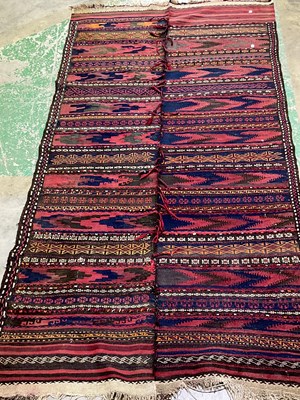 Lot 554 - A rug compriding of 2 runners stitches...