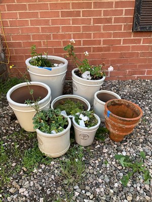 Lot 574 - A quantity of glazed garden pots and a small...