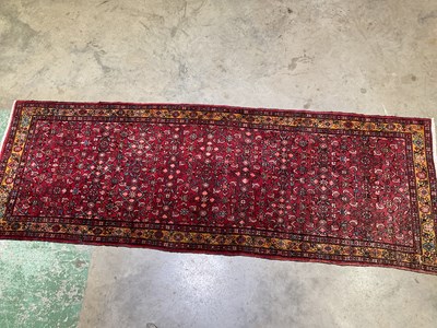 Lot 564 - A Persian rug, 320 x 110cm.