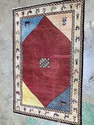 Lot 566 - A vintage woollen pile rug depicting animals...