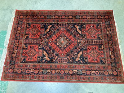 Lot 567 - A Heriz machine woven rug, 244 x 172cm.