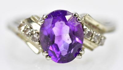 Lot 115 - An 18ct white gold amethyst and diamond dress...