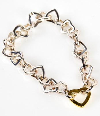 Lot 848 - TIFFANY & CO; a sterling silver heart link...