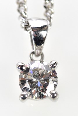 Lot 321 - An 18ct white gold diamond pendant, the four...