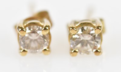 Lot 658 - A pair of 9ct yellow gold diamond ear studs...